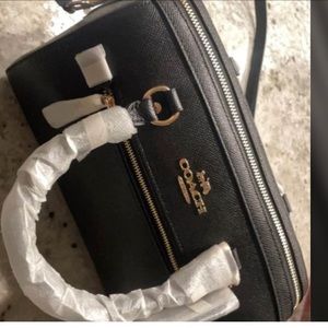 Black coach Rowan bag with gold accents. Never used